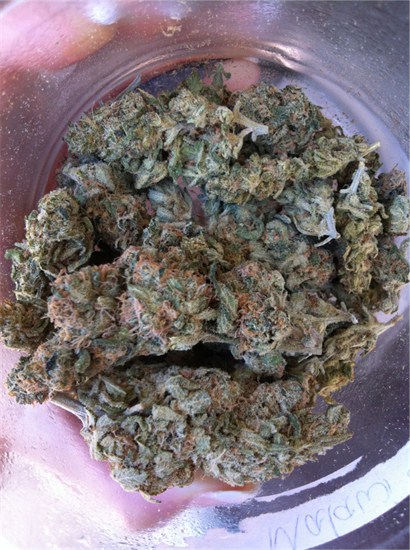 Photo taken looking into a jar filled with buds of the Malawi cannabis strain. Via Leafly.com